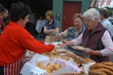 Nora Shine selling homemade bread & cakes