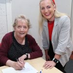 Mary Angland signing a copy of her Book for Muireann Stack